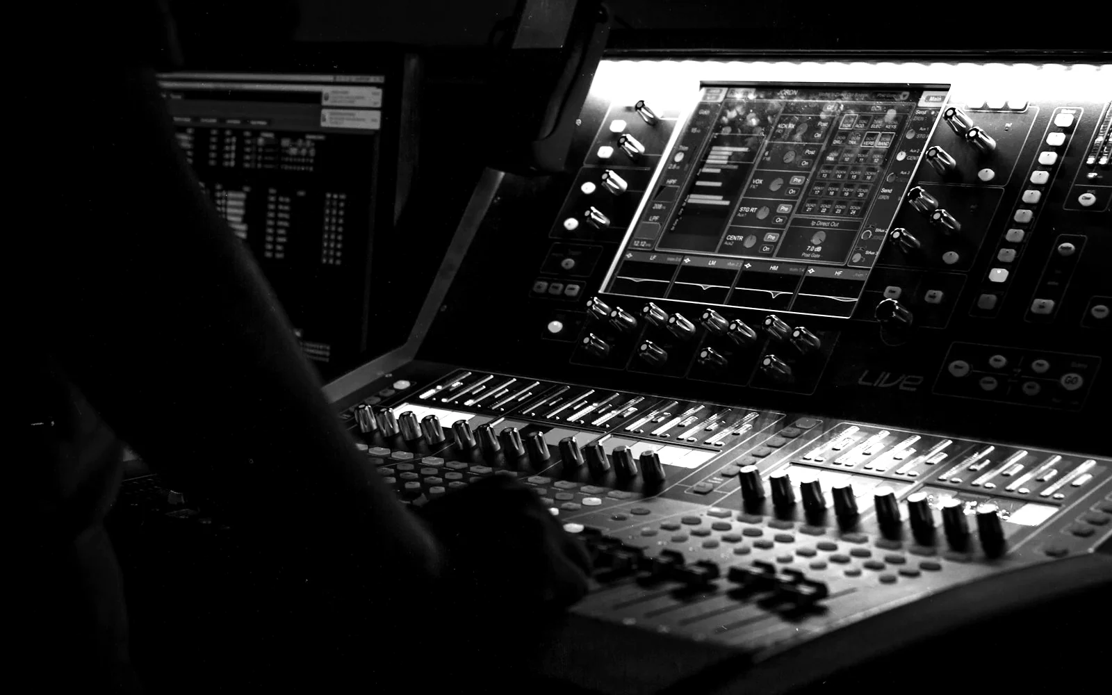 LIVEST crew running the front-of-house console during a show.