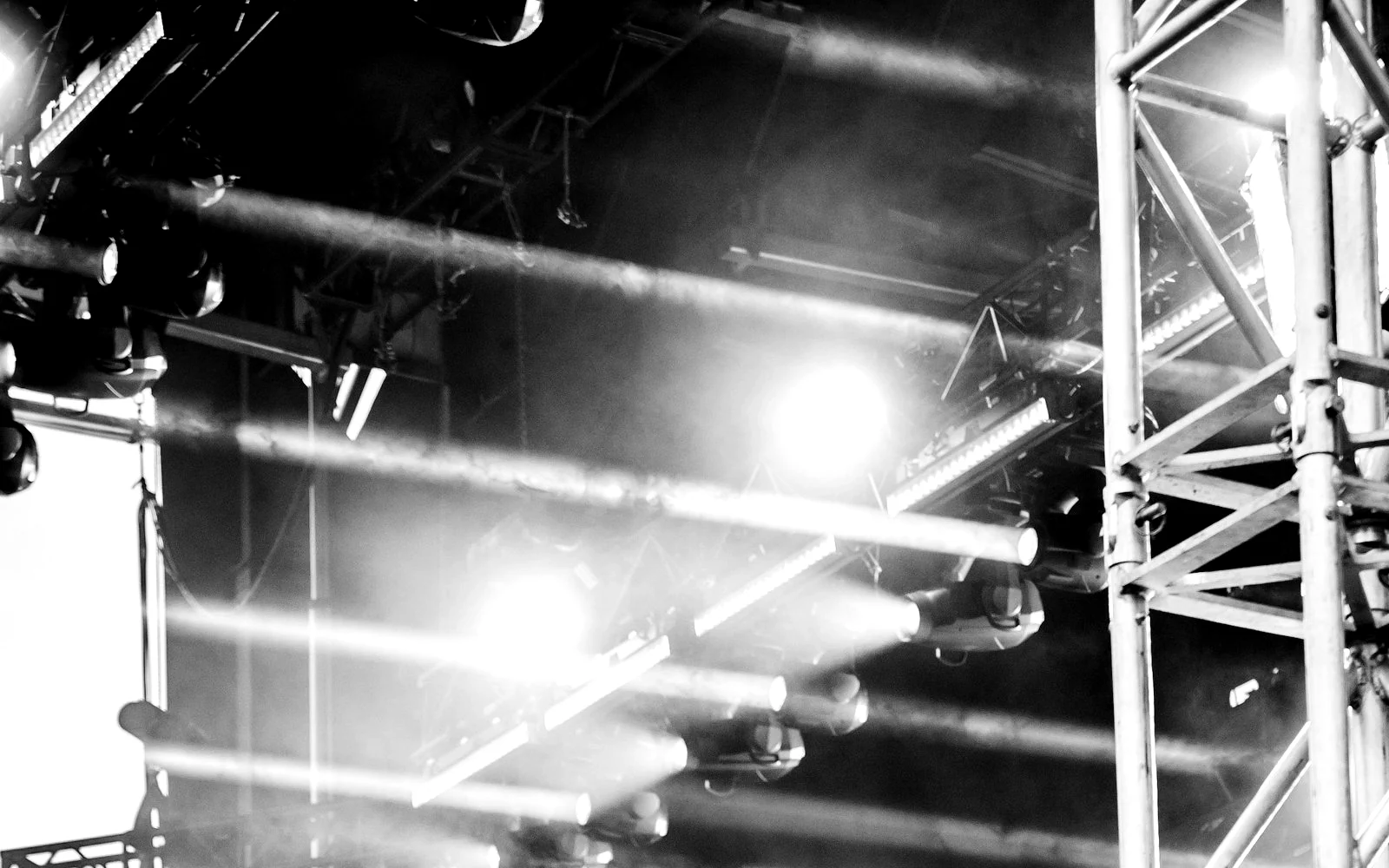 Light beams cutting through the rig above the stage.