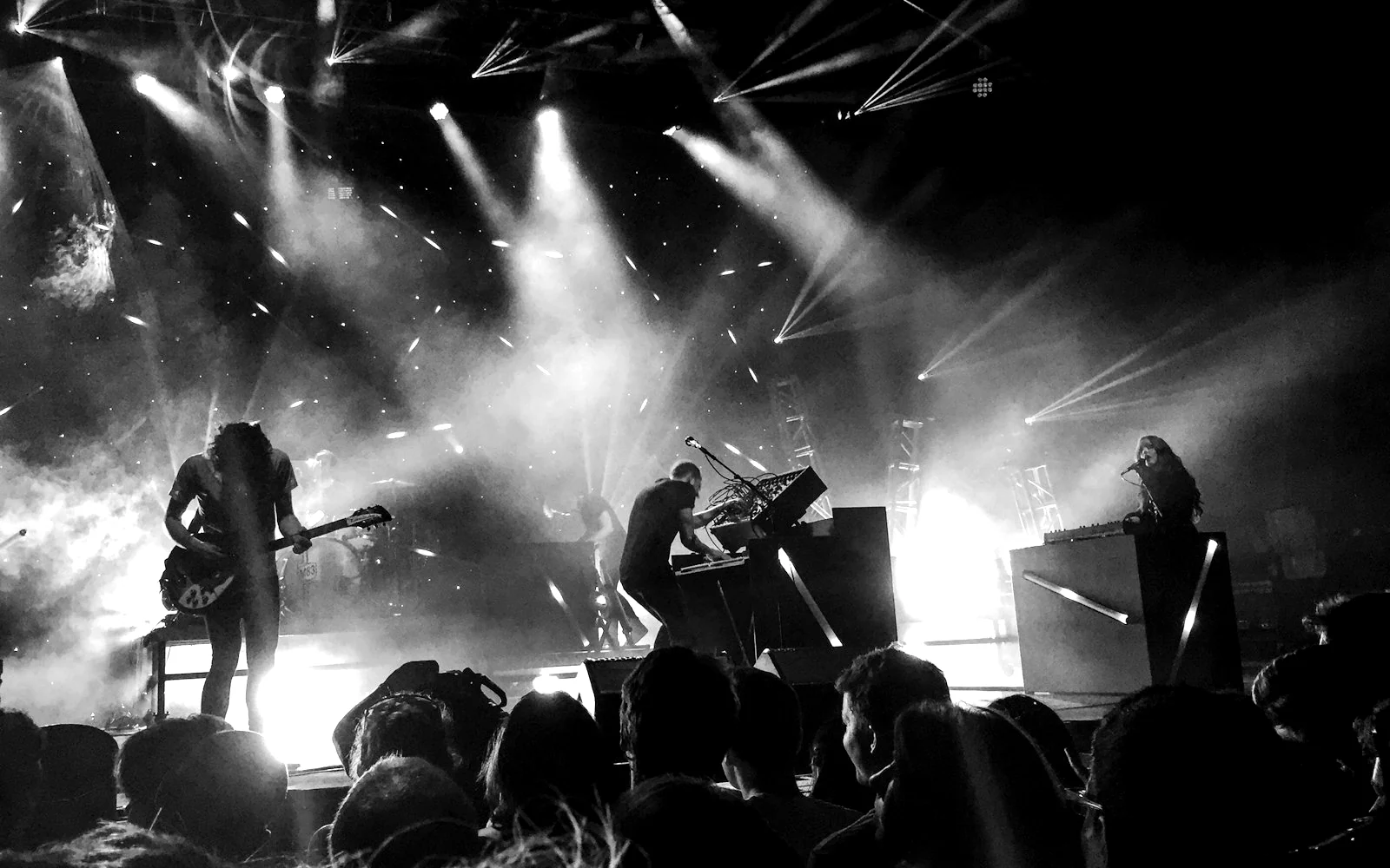 Band on stage under the light rig.